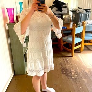 White flared sleeved patterned dress. Brand new with tags.  Tried on for photo